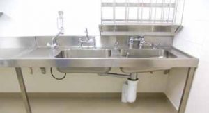 Sluice sink combo with right hand bowls and flush valve. Above right is the bedpan bottle rack BR6.